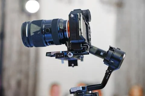 Professional mirrorless camera on a gimbal stabilizer Stock Photos
