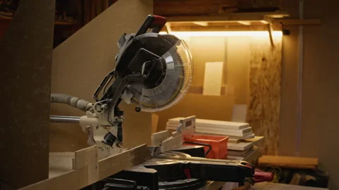 Professional Miter Saw Standing on Workbench in Carpentry Workshop Stock Footage 340391156