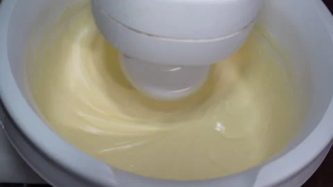 Professional mixer beating eggs with sugar, close-up Stock Footage 344133976