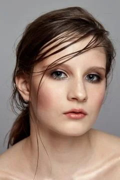 Professional model with delicate make-up and wet hair effect. Stock Photos