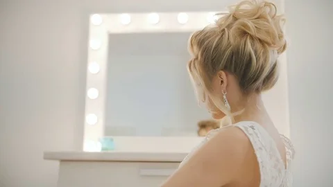 Professional model posing on camera. Turn on around chair Видео 74477943