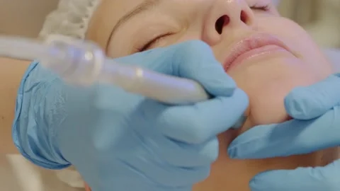 Professional moisturizing and rejuvenating hardware procedures in beauty salon. Stock Footage 213588307