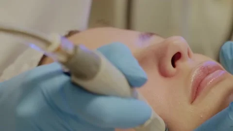 Professional moisturizing and rejuvenating hardware procedures in beauty salon. Stock Footage 235276741