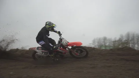 Professional Motocross Driver Riding On His Motorcycle Stock Footage