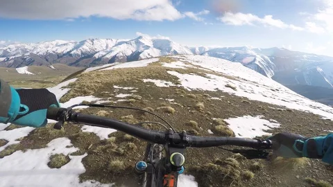 Professional Mountain Biker Riding Fast Down Big Snowy Mountains Video stock 101572089