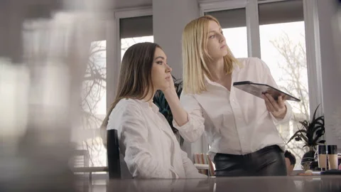 Professional MUA works in the studio preparing a model for a fashion show Stock Footage 152420955