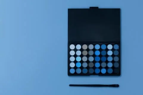 Professional multi-colored eye shadow palette on a light background. Stock Photos