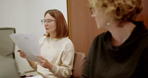 Professional, multi generational women working together in a business meeting Stock Footage 265610255