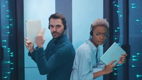 Professional multi-race armed spies on secret operation sneaking in server room Stock Footage 119842574