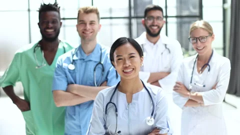 Professional Multinational Doctors Camera Posing. Working Together. Stock Footage 223365902