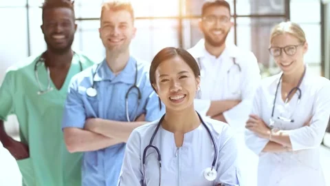 Professional Multinational Doctors Camera Posing. Working Together. Stock Footage 255714580