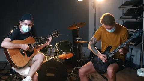 Professional music studio. Creative hobbies. Rehearsal of two young Caucasian Stock Footage 138655608