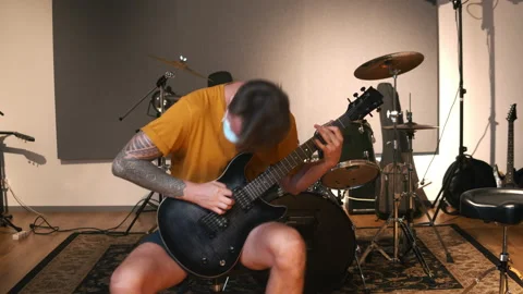 Professional music studio. Man playing guitar. Life of musicians throughout the Stock Footage 138525565