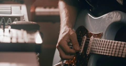 Professional musician plays instruments in the studio, sound recording process Stock Footage 318290845