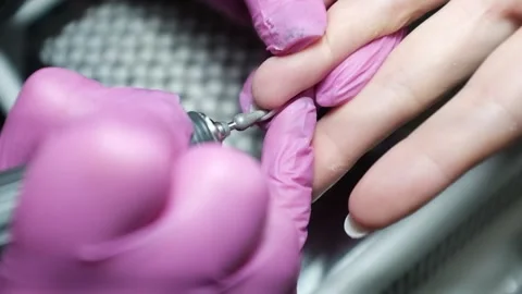 Professional nail technician removing cuticle with professional electric drill.  Stock Footage 326252028