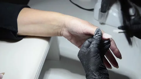 Professional nail technician using a manual nail file to remove old gel polish Stock-Footage 340815889