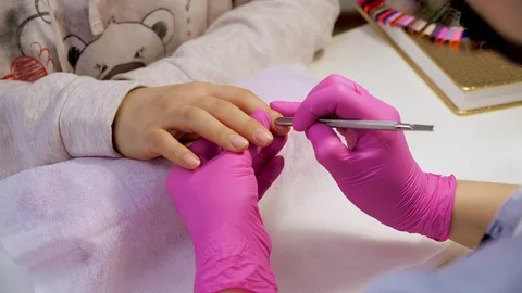 Professional nails cleaning close up. The process of cuticle lifting by Stock Footage 102262293