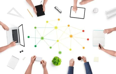 Professional networking concept with people siting on work desk and networkin Stock Photos