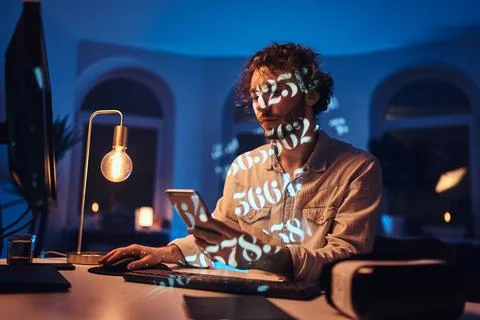 Professional occupation of guy working on computer and using phone Stock Photos