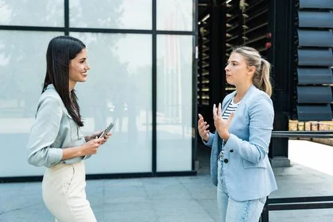 Professional occupation, office workers. Two business people meet before st.. Stock Photos