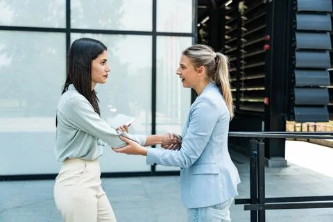 Professional occupation, office workers. Two business people meet before st.. Stock Photos