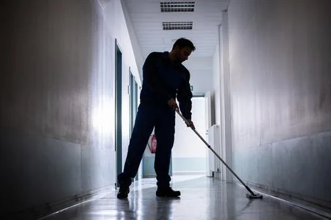 Professional Office Janitor Worker Cleaning Floor Stock Photos