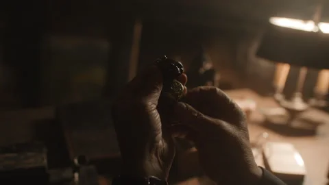 A professional opening antiques on the table Stock Footage 258294240