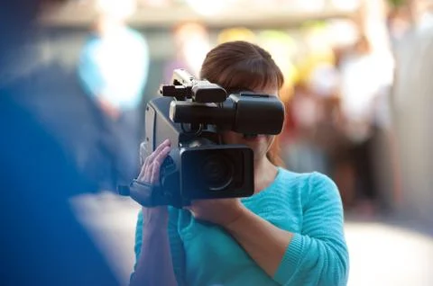 Professional operator with a video camera at work. Stock Photos
