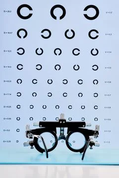 Professional ophthalmic trial frame with visual acuity chart, vertical Stock Photos
