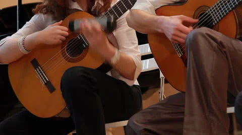 A professional  orchestra. playing the guitar Stock Footage 23560374