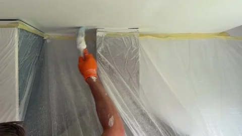 Professional painter painting a ceiling with white paint Video stock 341363322