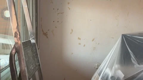 Professional painter prepping a room for renovation work Stock Footage 341363424