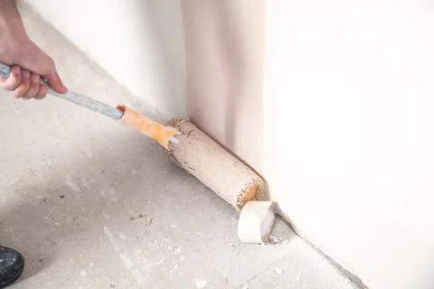Professional painter with roller. Renovation Stock Photos