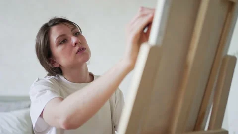 Professional painter. Work with brushes for drawing. The Face of a Focused Stock Footage 158094543