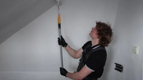 Professional painter working in attic room Stock Footage 335045953