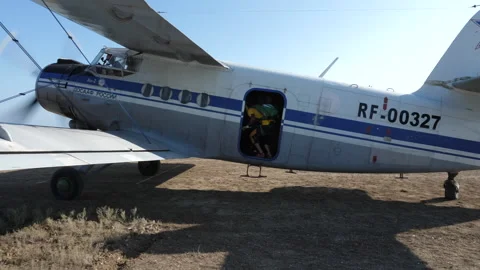 Professional parachute instructors board small airplane Stock Footage 144346728