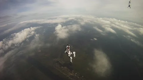 Professional parachutists free falling in cloudy sky. Extreme sport. Height Video stock 68447671