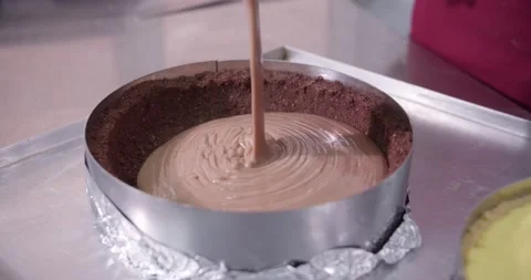 Professional pastry chef Pouring melted chocolate on cake. Confectionery, and Stock Footage 156335348