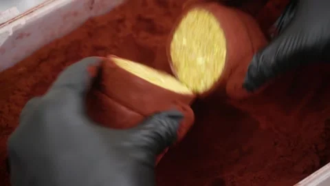 Professional Pastry Chef Rolling Chocolate Ganache Truffle Log in Cocoa Powder Stock Footage 337751705