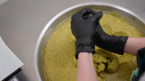 Professional Pastry Chef Scooping Pistachio Kataifi Filling for Dubai Chocolate Stock Footage 337751621
