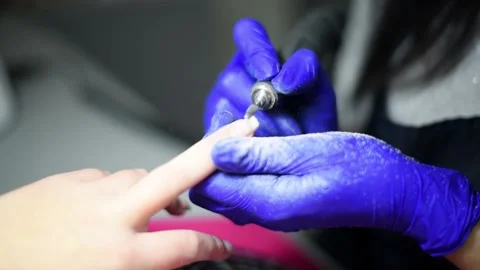 Professional pedicure master files nails , preparation for polishing with Stock Footage 235944517