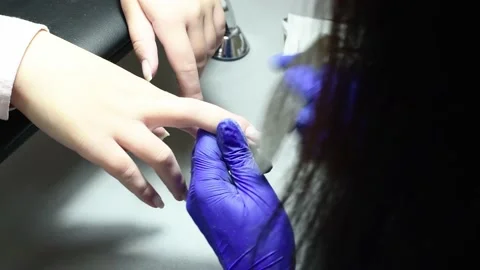 Professional pedicure master files nails , preparation for polishing with Stock Footage 236653852