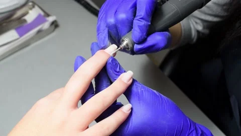 Professional pedicure master files nails , preparation for polishing with Stock Footage 236653871