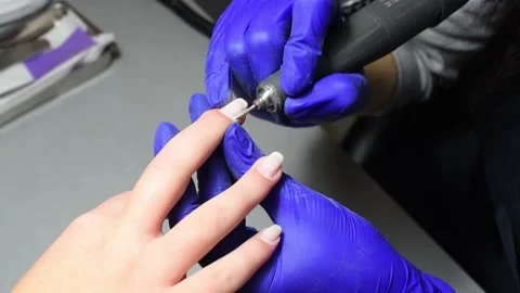 Professional pedicure master files nails , preparation for polishing with Stock Footage 236860254