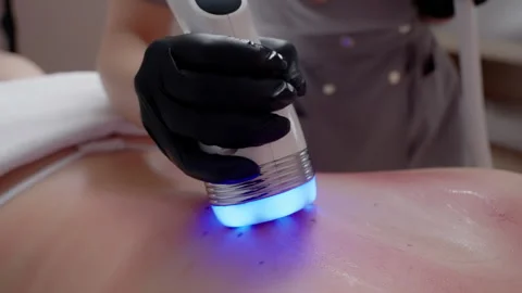 Professional Performing Light Therapy on Back Stock Footage 262363073