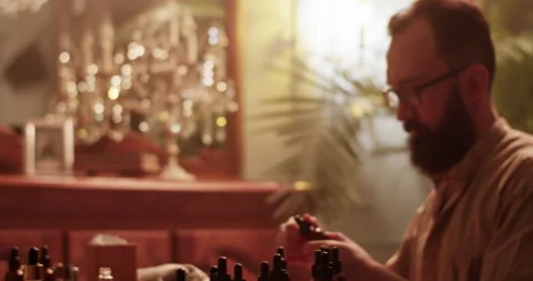 Professional perfumer taking bottle of oil at workplace Video stock 260984206