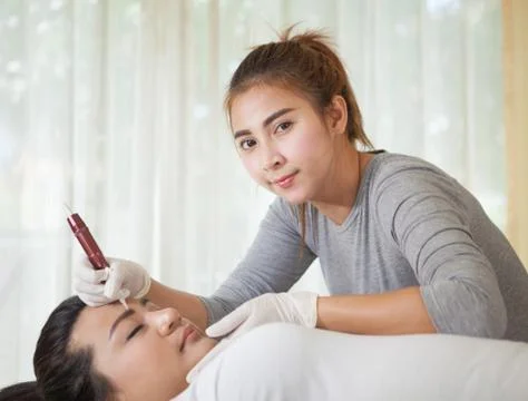 Professional permanent makeup applying Stock Photos