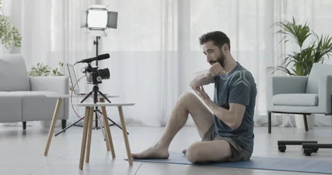 Professional personal trainer recording a video Stock Footage 157628576