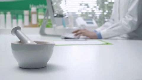 Professional pharmacist working with a computer Stock Footage 87904318