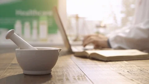 Professional pharmacist working with a laptop Stock Footage 87904705